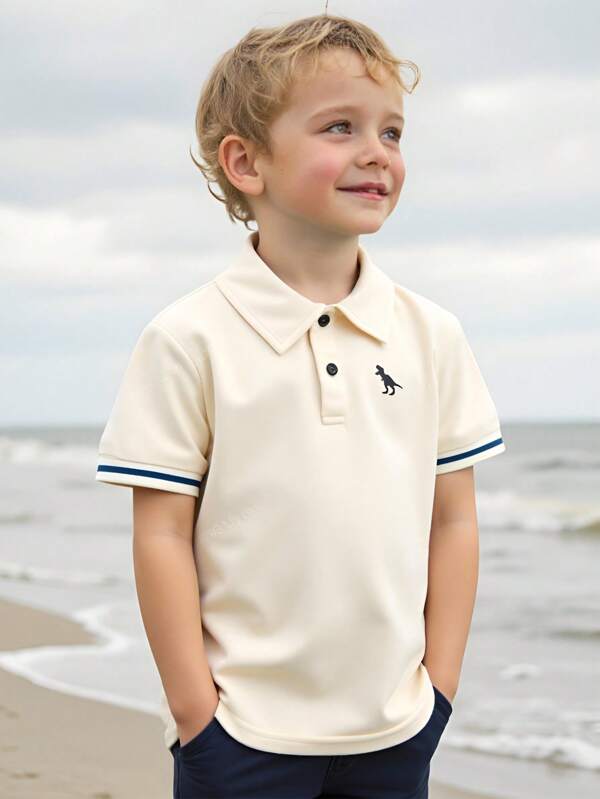 Cozy Pixies Camisa polo de punto suave con cuello vuelto y media cartera, con logo bordado de dinosaurio de dibujos animados para niño