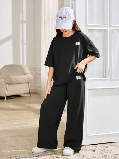 SHEIN Comfortable Black Fabric Tee And Long Sweatpants Co-Ords For Tween Girls Girls Shirt And Pants Set Girls Waffle Set Girls Wide Leg Pants Set Kids Black Outfit Kids Waffle Knit Set Girls Black Waffle Set Girls Black Outfit Set