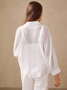 Wildy Blusa blanca de mujer con botones para uso casual en la oficina, camisa de manga larga de color blanco sólido, versátil y casual para mujeres, ideal para salir, fiestas, otoño y maestras - Blanco - Ver 6