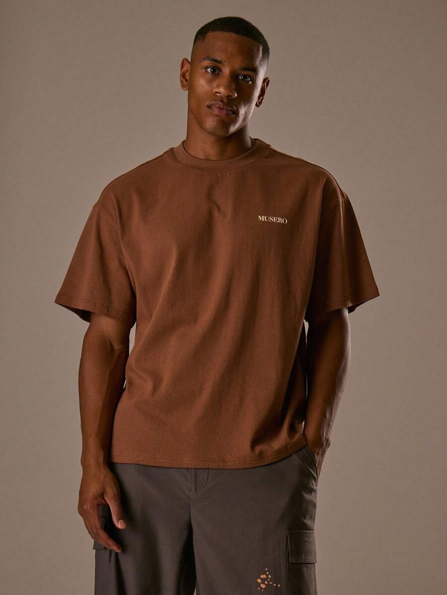 Musero Camiseta de manga corta con gráfico de jersey oversize, hombros caídos, para capas en primavera y verano - Marrón - Ver 1