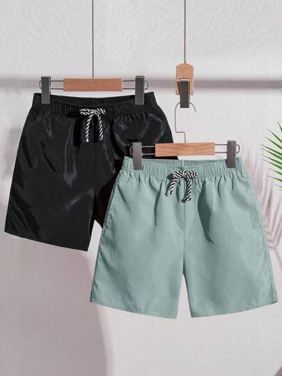SHEIN 2pcs/Set Tween Boys' Solid Color Loose Woven Casual Beach/Swimming Trunks, 2 Colors