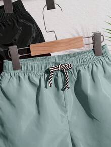 SHEIN 2 件套青少年男童纯色宽松梭织休闲沙滩/泳裤，2 种颜色