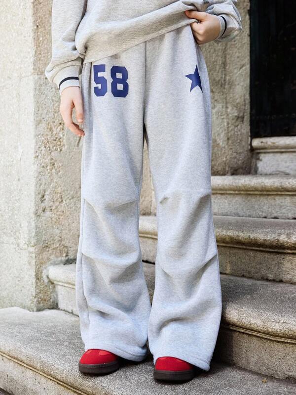 SHEIN Pantalones de chándal informales y sueltos con pliegues de franela con estampado de estrellas y números para niñas preadolescentes