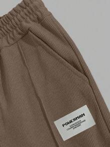 RueChic Ensemble deux-pièces composé d'un t-shirt régulier en coton avec détail d'étiquette et d'un pantalon