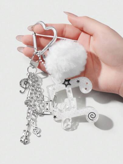 Anime 1 pièce Pendentif minimaliste et chic pour festival de musique haut de gamme avec boule blanche en peluche, ailes en acrylique, note de musique, instrument miniature (tape, cor, violoncelle, microphone), porte-clés en forme de cœur. Convient pour les femmes, port quotidien, cadeau de vacances