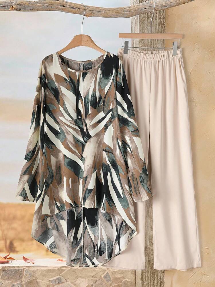 2pcs Plus Size Women Fall Contry Casual Vacation Full Print Round Neck Long Sleeve High-Low Hem Top And Wide Leg Pants Loose 2 Pieces Set,Winter Pants Set,Blouse And Pants Set,Winter,Going Out Outfits,2025 New Clothes,Simple And Fashionable For Everyday Wear