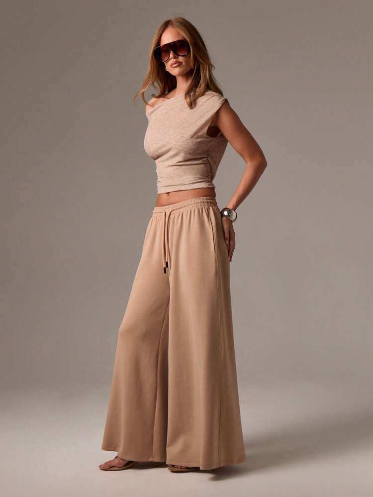 Pantalones palazzo de pierna ancha con cordón y bolsillos laterales