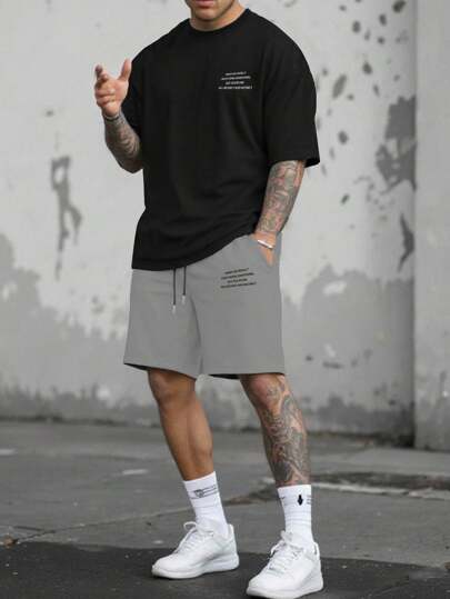 Manfinity Homme طقم تيشيرت وشورت كاجوال مطبوع عليه شعار، صيفي