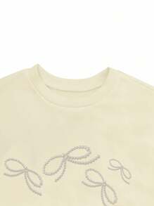 Resyla Áo nỉ cổ tròn dáng rộng có nơ đính hạt trang trí cho nữ - Màu be - Xem 4