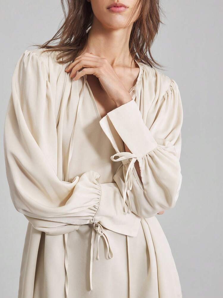 New 2025 Women Elegant Pleated Collar & Cuff Tie Detail Blouse, Round Neck, Long Sleeve, Satin Fabric, Apricot Color, Loose Fit, Casual/Business Wear, Chic Top Business Casual Women's Clothing Office Clothing Low-Key Old Money Style Effortless Temperament High-End Urban Commuting High-Quality Airport Women's Clothing High-End Material Beach Clothing, Bohemian Style Vacation Wear, Summer Ins Celebrity Same Style Vacation Style, Exotic Atmosphere, Country Concert, Western Style Clothing