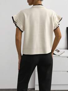 SHEIN بلوزة كارديجان أنيقة بمقاسات كبيرة مع أزرار أمامية وأكمام مطوية وحواف سوداء وبيضاء وتفاصيل كشكشة ناعمة من الصوف المحبوك وأزرار لؤلؤية بأسلوب عتيق أنيق للربيع - لون مشمشي - مشاهدة 2
