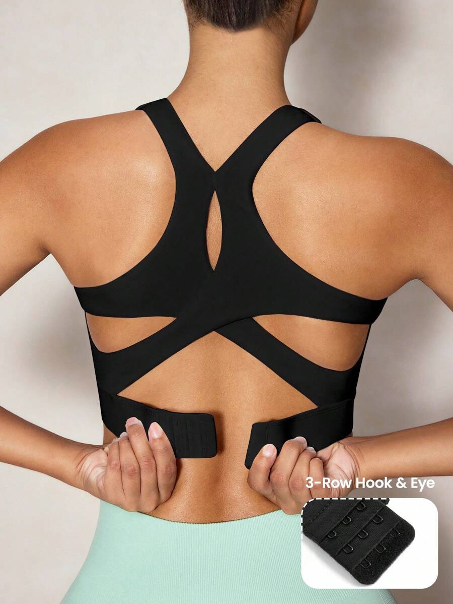 SHEIN Velisys Sujetador deportivo minimalista de unicolor con diseño cruzado y calado para mujeres