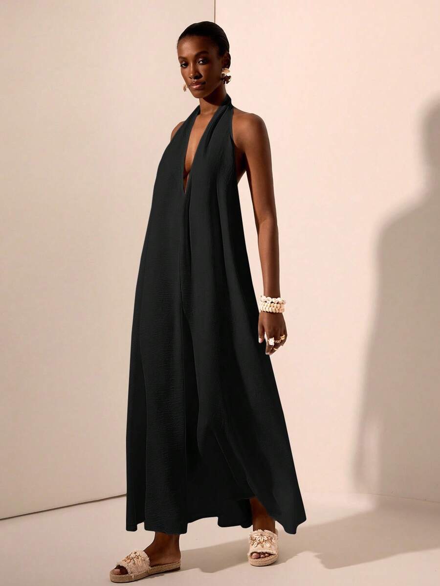 Zivah Lễ hội âm nhạc mới Xuân/Hè 2025, Lễ Phục sinh, Ngày Thánh Patrick, Phong cách phương Tây, Du mục, Tiệc sinh nhật, Tốt nghiệp, Phong cách đại học, Trang phục sinh viên, Thường ngày, Đa năng, Giải trí, Du lịch du thuyền, Bãi biển, Tắm nắng, Lan truyền, Thời trang đường phố, Khách dự tiệc cưới Boho, Đi làm, Ăn trưa, Sân bay, Váy maxi cổ chữ V sâu buộc dây họa tiết màu trắng, Váy maxi hở lưng - màu đen - Xem 1