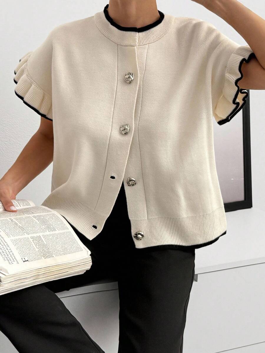 SHEIN بلوزة كارديجان أنيقة بمقاسات كبيرة مع أزرار أمامية وأكمام مطوية وحواف سوداء وبيضاء وتفاصيل كشكشة ناعمة من الصوف المحبوك وأزرار لؤلؤية بأسلوب عتيق أنيق للربيع - لون مشمشي - مشاهدة 1