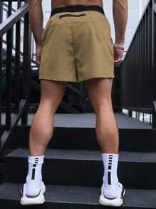Gym Rark Pantalones cortos deportivos con bloques de color caqui para hombres con bolsillo para entrenamiento y ejercicios, pantalones cortos atléticos para gimnasio y entrenamiento, livianos - Caqui - Ver 2