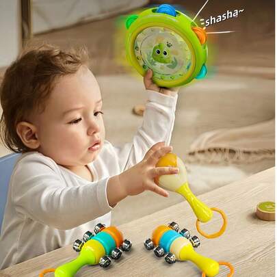 Zazumi Bộ 3 món đồ chơi lục lạc cho bé, hộp quà tặng, đồ chơi rèn luyện khả năng cầm nắm cho trẻ sơ sinh, đồ chơi cảm giác, trống lắc nhiều màu sắc, nhạc cụ học tập sớm, phát triển trong năm đầu đời, chất liệu mềm mại (Kiểu dáng và phụ kiện ngẫu nhiên)