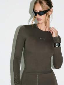 KIZN Long Sleeve Form Fitting Bodysuit Mock Neck Design With Metallic Logo Detail Stretch Jersey Fabric Classic Fall Winter Essential Fashion Basic Top Sheer Slinky Material - Coffee Brown - View 1