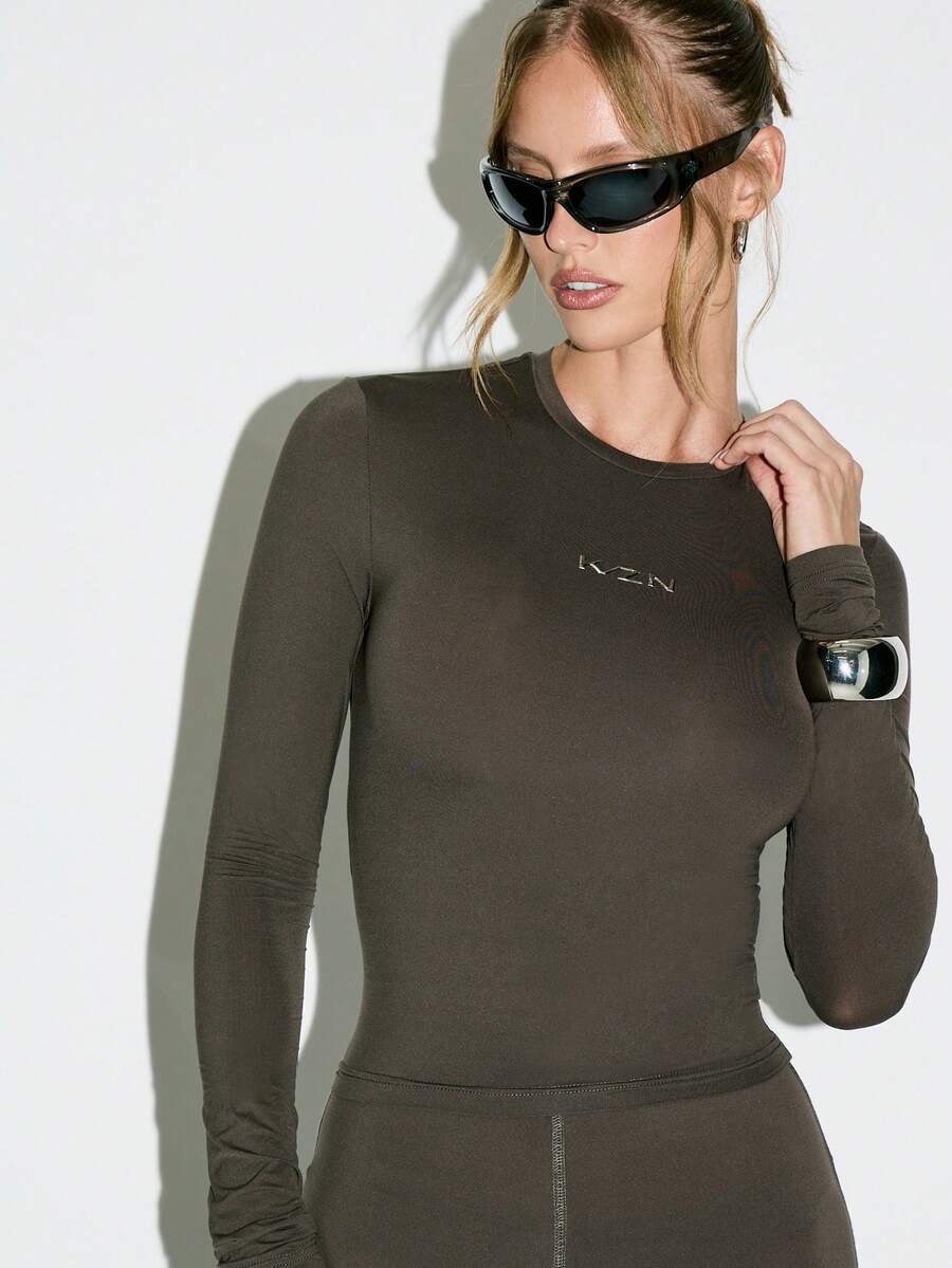 KIZN Long Sleeve Form Fitting Bodysuit Mock Neck Design With Metallic Logo Detail Stretch Jersey Fabric Classic Fall Winter Essential Fashion Basic Top Sheer Slinky Material - Coffee Brown - View 1