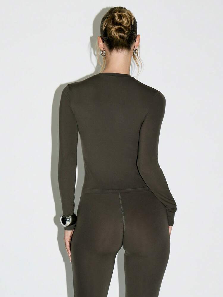 KIZN Slinky Mock Neck Bodysuit With Metallic Logo