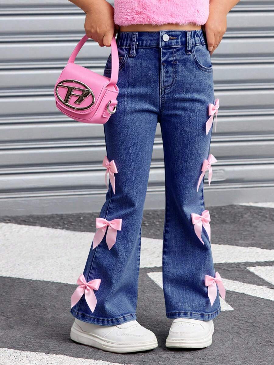 SHEIN Young Girl' Pink Bow Decor Blue Denim Elastic Skinny Flare Jeans ,Kid Girls Spring And Summer Casual Vacation Country Boho Wear, Beach Outfits For Kid Girls,Western Street Wear For Girl,Spring Break Outfits,Rave Outfits Festival Denim Bell Bottoms, Girls Jeans With Bows, Jeans With Pink Bows Fall Winter - Dark Wash - View 1
