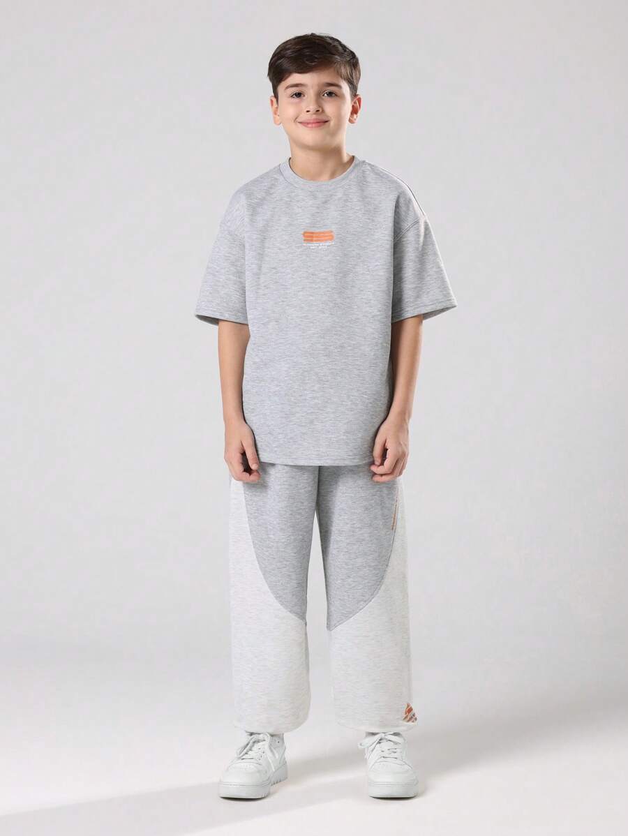 SUMWON Ensemble deux pièces pour pré-adolescents, Sweat-shirt-shirt gris chiné et jogging à larges jambes avec bloc de couleurs et imprimé logo orange. Tenue d'automne et d'hiver