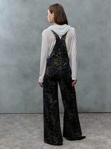 TypaGal These Wide-Leg Camo Print Overalls Add Wild Energy To Any Outfit. Layered Over A Sheer Hoodie, They Mix Utility And Attitude With Ease.