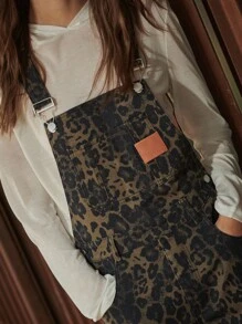 TypaGal These Wide-Leg Camo Print Overalls Add Wild Energy To Any Outfit. Layered Over A Sheer Hoodie, They Mix Utility And Attitude With Ease.