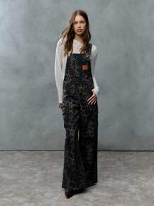 TypaGal These Wide-Leg Camo Print Overalls Add Wild Energy To Any Outfit. Layered Over A Sheer Hoodie, They Mix Utility And Attitude With Ease.