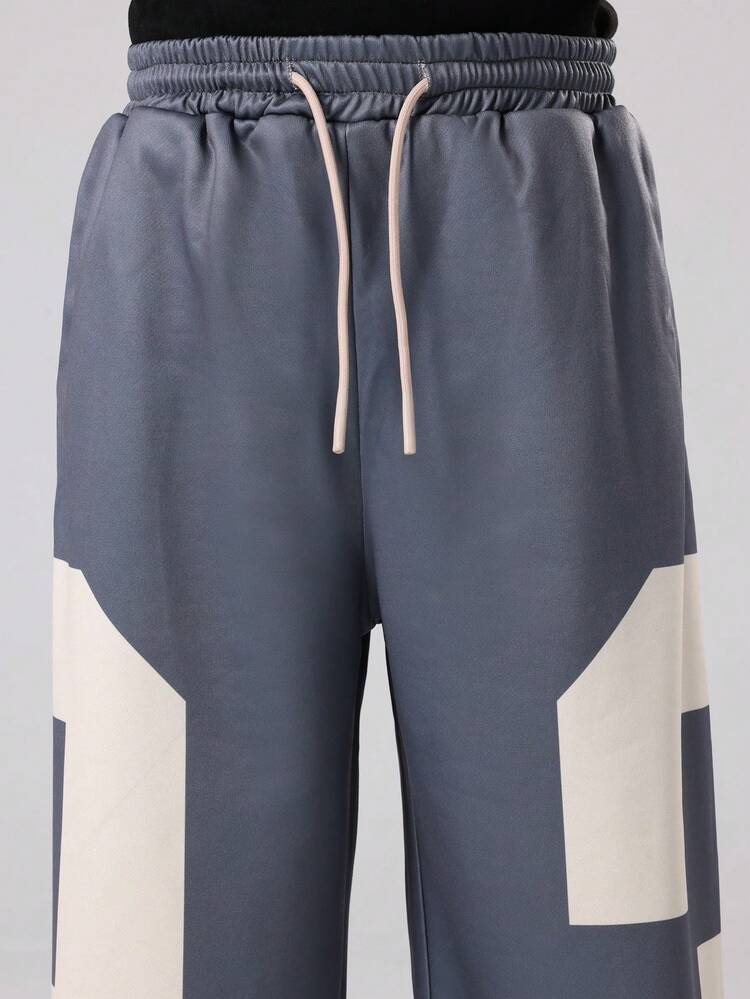 Pantalones deportivos de pierna ancha con bloques de color y cordón ajustable