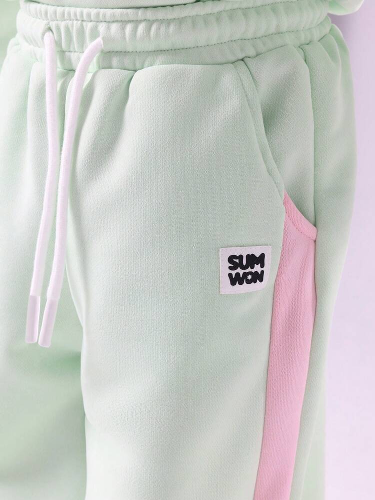 Mintgrünes Sweatshirt und Hose mit weitem Bein und rosa Text im Set