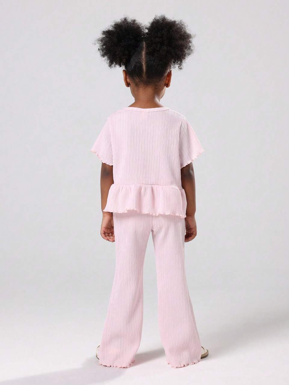 Plisse Peplum Top And Flared Pants Set