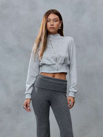TypaGal This Grey Zip-Up Sweatshirt Is Cropped And Cozy, Ideal For Back To School. The Rhinestone Bow On The Back Adds A Girly Y2K Sparkle To Any Fall Look.