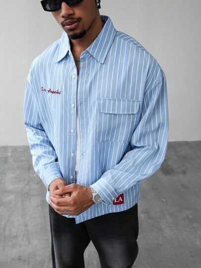 Manfinity EMRG Men's Drop Shoulder Vertical Stripe Long Sleeve Shirt With Los Angeles Embroidery, Autumn Casual Streetwear For Everyday & Campus Style, Perfect Gift For Boyfriend Blue Striped Shirt Light Blue Button Up Men Striped Button-Down Shirt Long Sleeve Striped Shirt Men Cityboy Shirt, 2000s Style, Fall