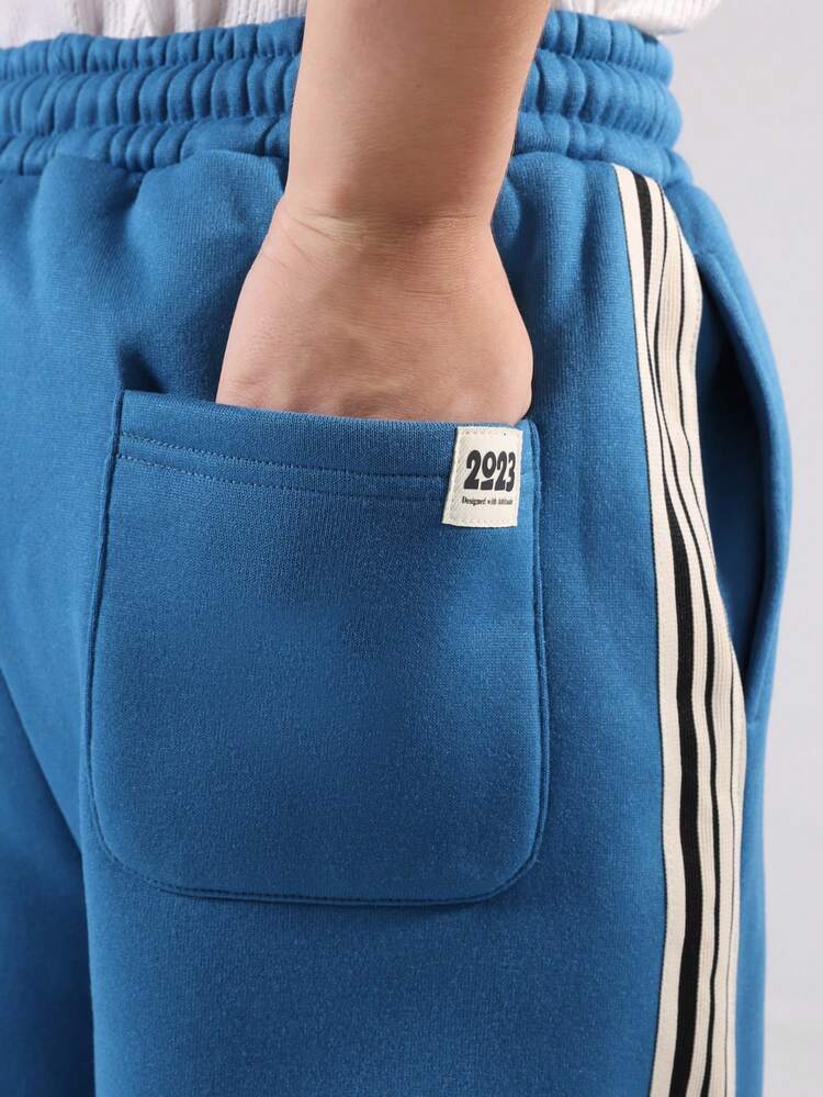 コントラストサイドストライプのワイドレッグスウェットパンツ