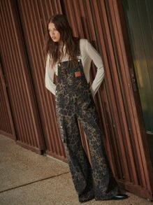 TypaGal These Wide-Leg Camo Print Overalls Add Wild Energy To Any Outfit. Layered Over A Sheer Hoodie, They Mix Utility And Attitude With Ease.