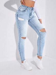 破洞紧身牛仔裤