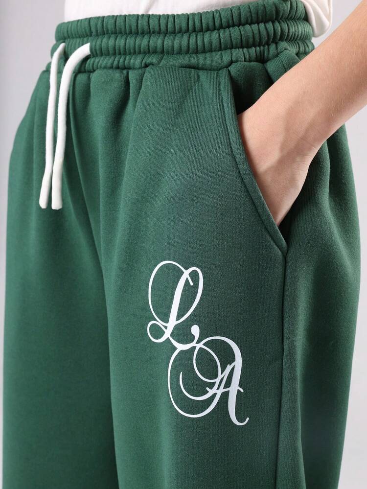 Pantaloni della tuta a gamba larga con tasche laterali e stampa scritta