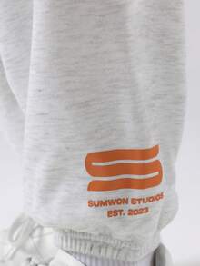SUMWON Ensemble deux pièces pour pré-adolescents, Sweat-shirt-shirt gris chiné et jogging à larges jambes avec bloc de couleurs et imprimé logo orange. Tenue d'automne et d'hiver