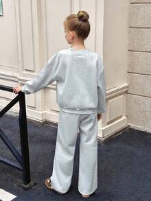 SHEIN Tween Girls Solid Light Gray Fleece Inner Oversize V-Neck Fluffy Loose Fit Long Sleeve Sweatshirt With Print And Wide Leg Sweatpants, Small Logo Print,  Sweatshirt And Sweatpants Set For Autumn/Winter, Tween Girl Sweatshirt Pants Set Girl Two Piece Long Sleeve Set Tween Matching Set Teen Girls 2 Piece Pants Set Casual Two Piece Set Grey Sweatpants Set V-Neck Sweat Suit Sweatshirt Straight Pants Suit Tween Girl Teen Two Piece Long Sleeve Set - Light Grey - View 11