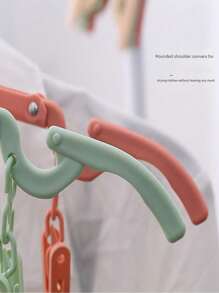 SHEIN Portable Folding Clothes Hanger - Easy To Store, New Material, No Old Materials Added, Multi-Color Clips To Meet Different Drying Needs, Non-Slip Design, Shoulder Support, Can Be Enlarged And Reduced, A Must-Have For Travel, Saves Wardrobe Space!(The Product May Have Slight Color Changes Due To Batch Problems, But The Quality Remains Unchanged And Does Not Affect The Appearance And Use)
