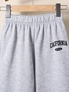 Spodnie dresowe dla nastolatek, codzienne, uniwersalne, wygodne, z nadrukiem, z luźnym ściągaczem w pasie i jednolitym kolorem, dzianinowe, odpowiednie do dojazdów do pracy, szkoły, na co dzień, na wakacje, do sportu, na wiosnę/lato/jesień/zimę