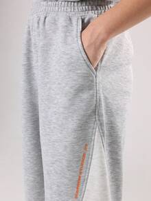 SUMWON Ensemble deux pièces pour pré-adolescents, Sweat-shirt-shirt gris chiné et jogging à larges jambes avec bloc de couleurs et imprimé logo orange. Tenue d'automne et d'hiver