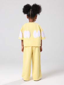 SUMWON Set de două piese de vară pentru fete tinere, bluză de trening galbenă cu pantaloni largi, cu imprimeu de logo-ul mărcii, ținută casual de zi cu zi, 4-7 ani - Galben - Vizualizare 1