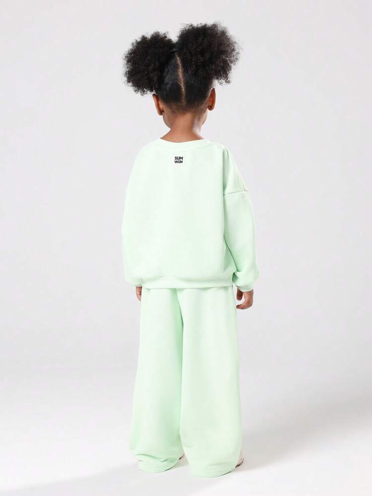 Mintgrünes Sweatshirt und Hose mit weitem Bein und rosa Text im Set