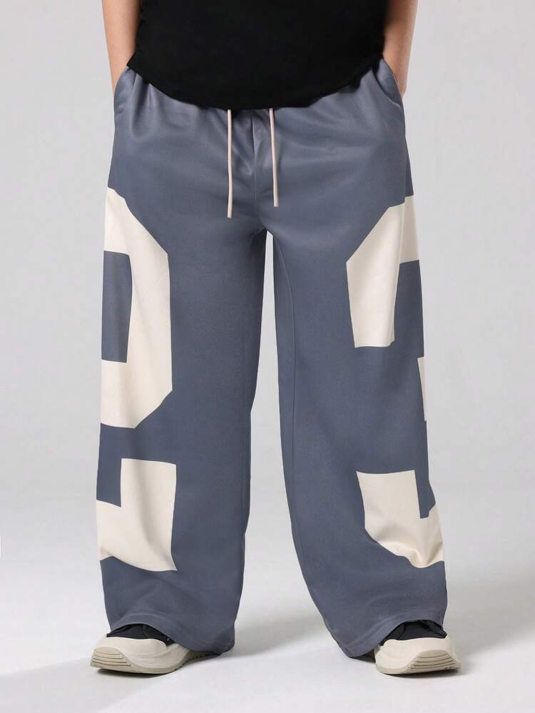 Pantalones deportivos de pierna ancha con bloques de color y cordón ajustable