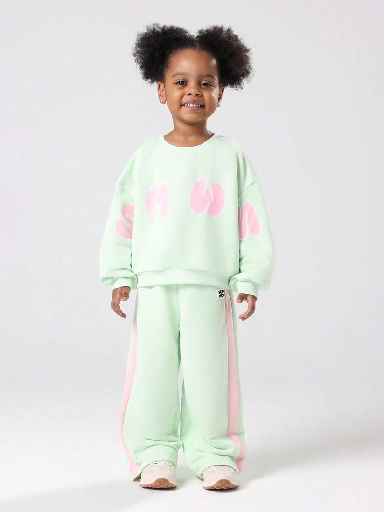 Mintgrünes Sweatshirt und Hose mit weitem Bein und rosa Text im Set