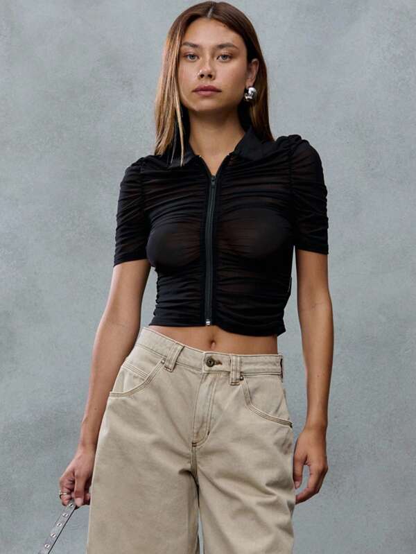 TypaGal Black Ruched Mesh Zip-Up Polo Top With Short Sleeves. Channeling A Grungy Punk Vibe, It's A Bold Back To School Pick With A 2000s Flair. Great Layered Or Solo.