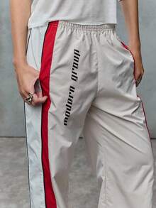 TypaGal These Wide-Leg Track Pants Bring Throwback Energy. With Bold Red Stripes And Print, They're Perfect For 2000s-Style Fall. - Multicolor - View 5
