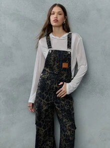 TypaGal These Wide-Leg Camo Print Overalls Add Wild Energy To Any Outfit. Layered Over A Sheer Hoodie, They Mix Utility And Attitude With Ease.