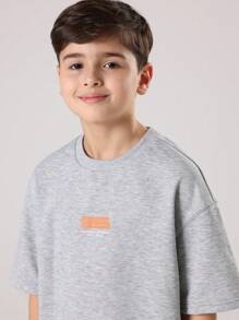 SUMWON Ensemble deux pièces pour pré-adolescents, Sweat-shirt-shirt gris chiné et jogging à larges jambes avec bloc de couleurs et imprimé logo orange. Tenue d'automne et d'hiver